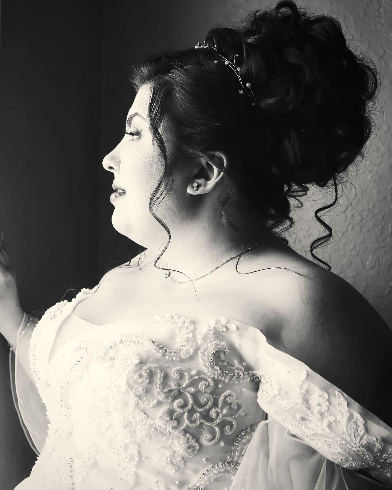 Bride with voluminous curled updo and tiara